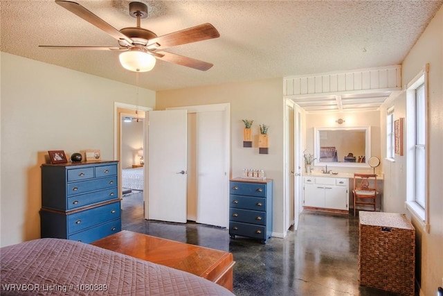3745 E 420th Rd, Adair, OK 74330 - bedroom featuring concrete flooring, a ceiling fan, a textured ceiling, and a closet