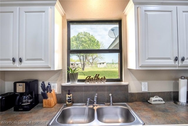 3745 E 420th Rd, Adair, OK 74330 - kitchen featuring dark countertops, white cabinetry, and a sink