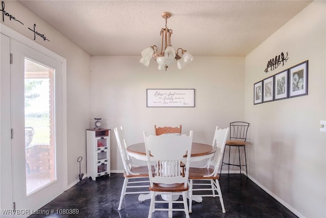 3745 E 420th Rd, Adair, OK 74330 - dining room with an inviting chandelier, a textured ceiling, baseboards, and finished concrete floors