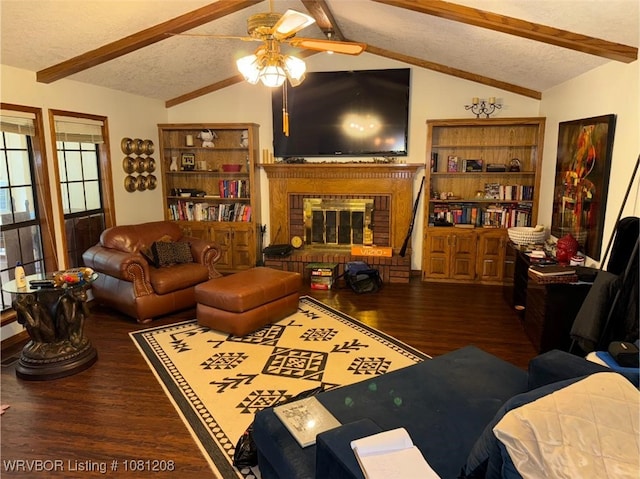 2904 Cedar Valley Dr, Greenwood, AR 72936 - living area with wood finished floors, a ceiling fan, a fireplace, and a textured ceiling