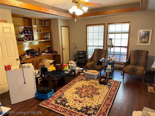 2904 Cedar Valley Dr, Greenwood, AR 72936 - sitting room featuring a ceiling fan, dark wood-type flooring, and a tray ceiling