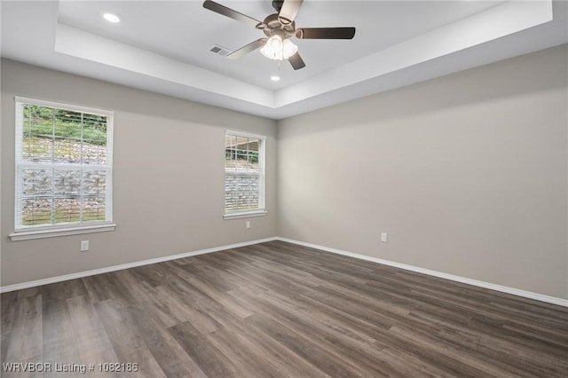 2325 Amy Ln, Van Buren, AR 72956 - spare room with a tray ceiling, dark wood finished floors, ceiling fan, and recessed lighting