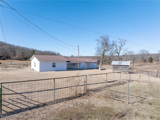 view of yard featuring driveway and fence