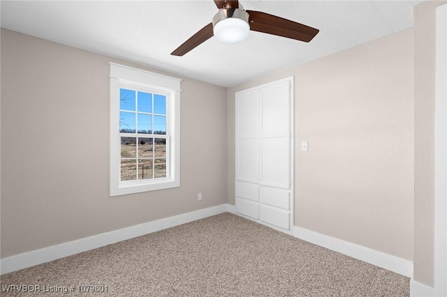 unfurnished bedroom featuring carpet flooring, a ceiling fan, and baseboards