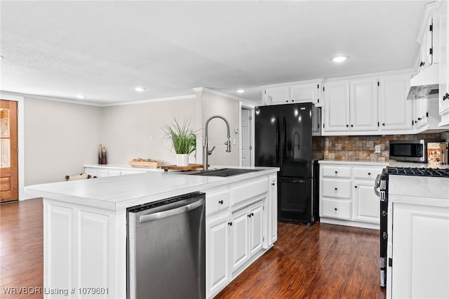 kitchen featuring a sink, light countertops, under cabinet range hood, appliances with stainless steel finishes, and white cabinetry