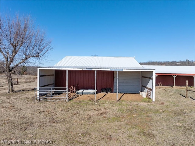 view of outbuilding featuring an outbuilding and an exterior structure