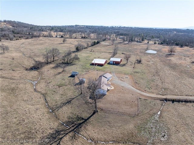 birds eye view of property featuring a rural view