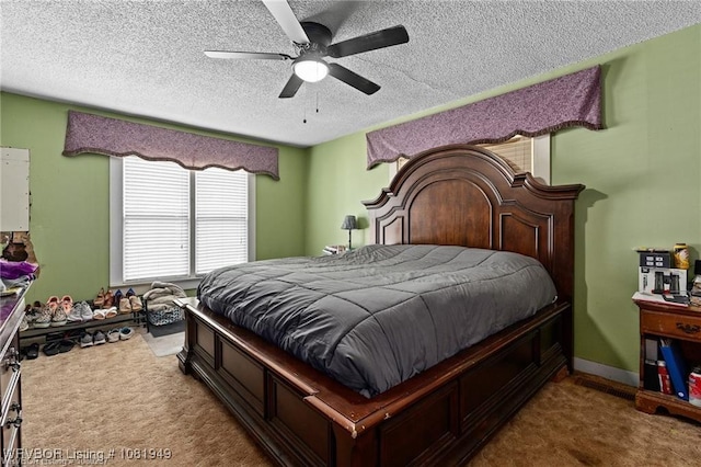 1120 Second St, Charleston, AR 72933 - carpeted bedroom with a textured ceiling and a ceiling fan