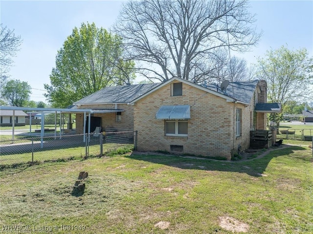 1120 Second St, Charleston, AR 72933 - view of property exterior featuring brick siding, a chimney, and a carport