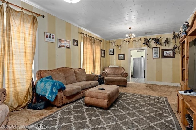 1120 Second St, Charleston, AR 72933 - living room featuring crown molding, a chandelier, and carpet floors