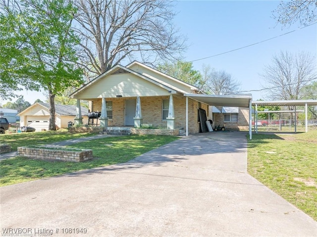 1120 Second St, Charleston, AR 72933 - view of front of house featuring brick siding, driveway, a front lawn, a porch, and an attached carport
