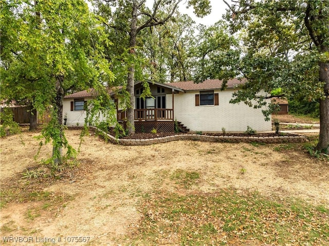 rear view of property with a deck