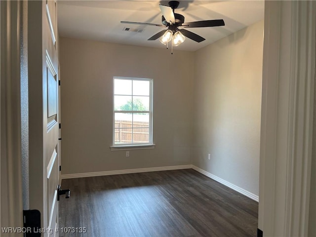 spare room featuring ceiling fan and dark hardwood / wood-style floors