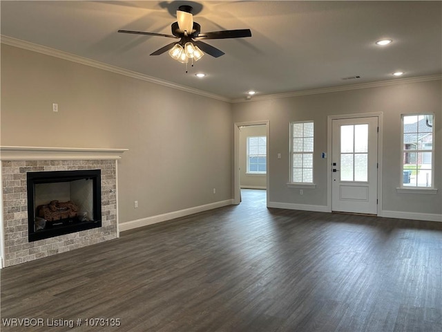 unfurnished living room featuring dark hardwood / wood-style flooring, ceiling fan, and crown molding