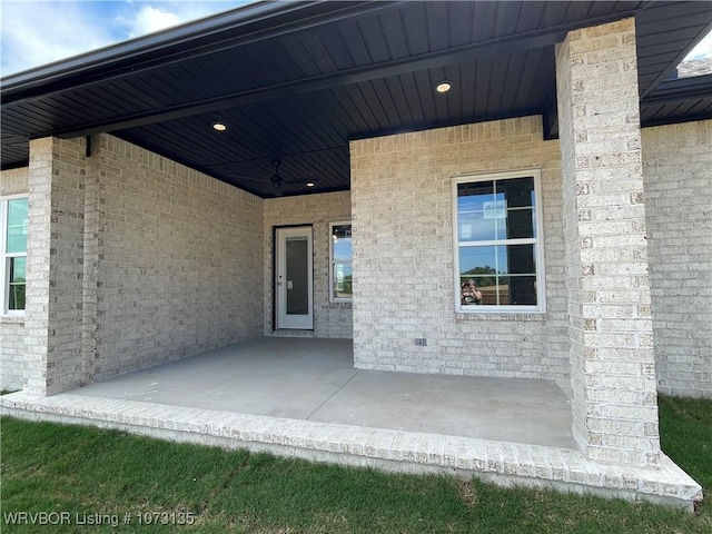 doorway to property with a patio area