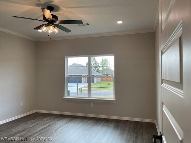 empty room with dark hardwood / wood-style floors, ceiling fan, and crown molding