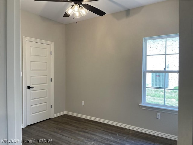 unfurnished room featuring ceiling fan and dark wood-type flooring