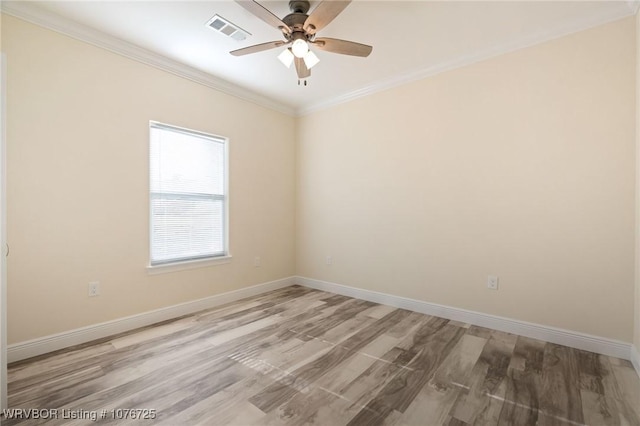 spare room featuring ceiling fan, light hardwood / wood-style flooring, and ornamental molding