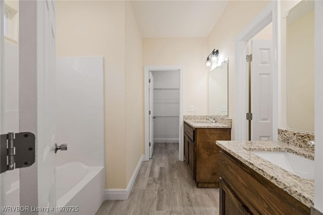 bathroom featuring vanity and hardwood / wood-style flooring