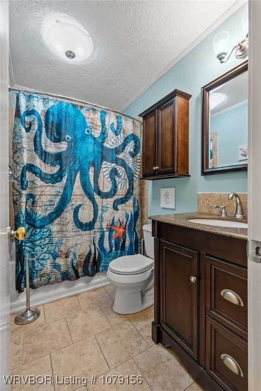 bathroom with tile patterned flooring, toilet, a textured ceiling, and vanity