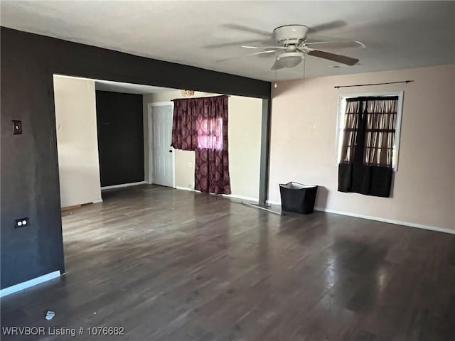 empty room featuring hardwood / wood-style flooring and ceiling fan