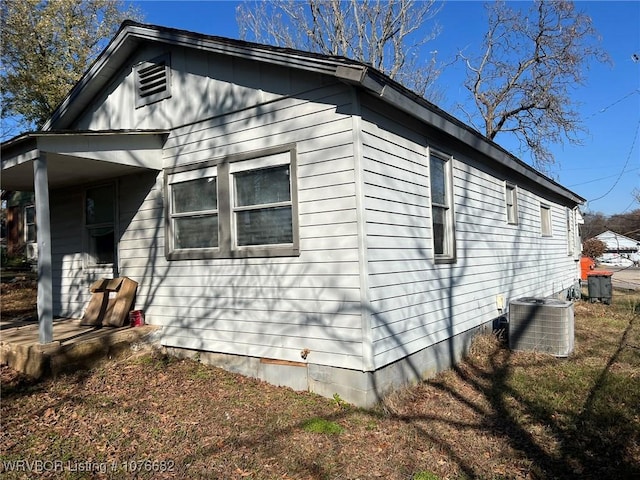 view of property exterior with central AC