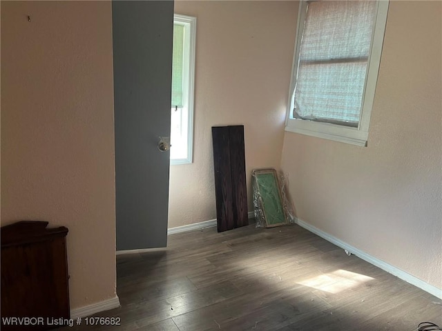 unfurnished room featuring hardwood / wood-style flooring