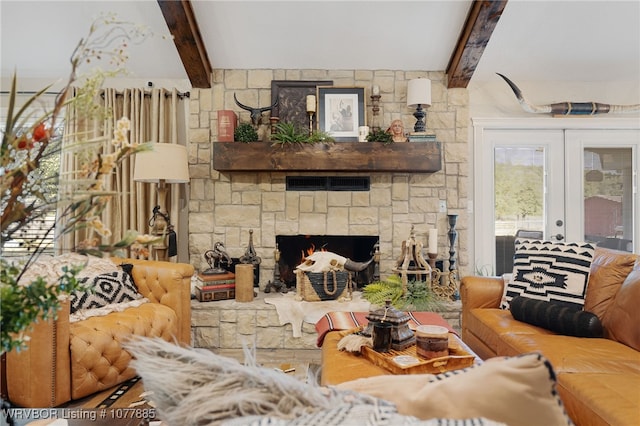 living room with a fireplace, beam ceiling, and french doors