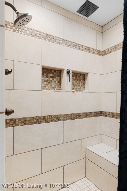 bathroom with a tile shower