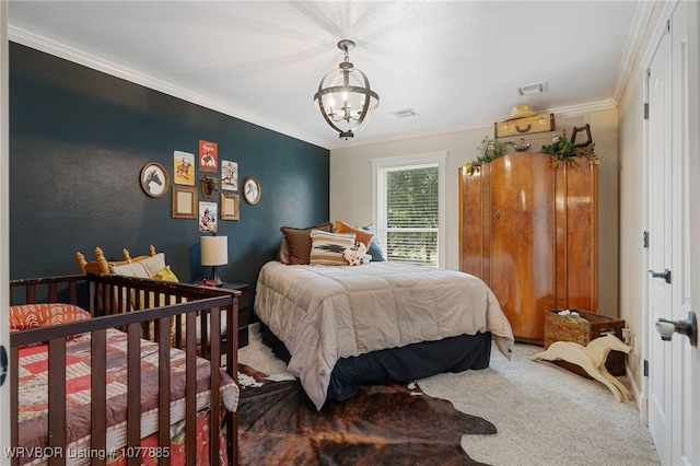 bedroom featuring carpet, an inviting chandelier, and crown molding