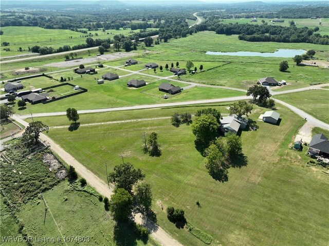 bird's eye view with a water view and a rural view