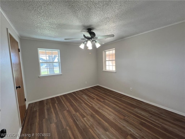 spare room with ceiling fan, dark hardwood / wood-style flooring, ornamental molding, and a wealth of natural light