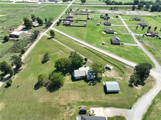 birds eye view of property featuring a rural view