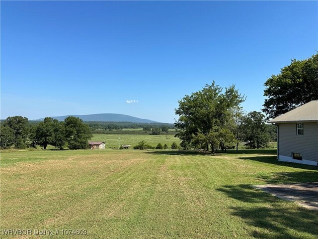 view of yard featuring a mountain view and a rural view