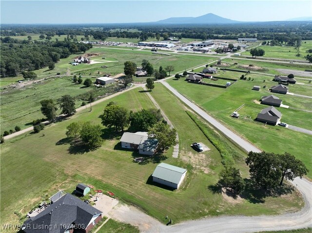 birds eye view of property with a mountain view