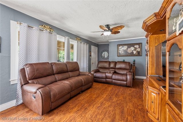 4209 Old Jenny Lind Rd, Fort Smith, AR 72901 - living room featuring wood finished floors, ceiling fan, a textured ceiling, ornamental molding, and baseboards