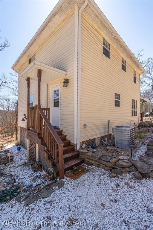 view of property exterior with central AC unit