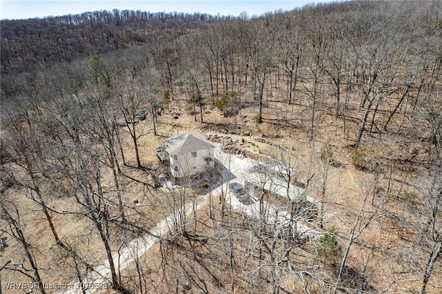 bird's eye view featuring a wooded view