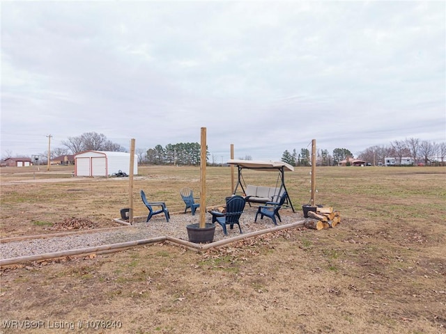 view of yard with an outbuilding and a garage