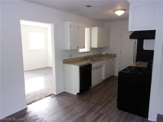 kitchen featuring white cabinets, exhaust hood, and black appliances