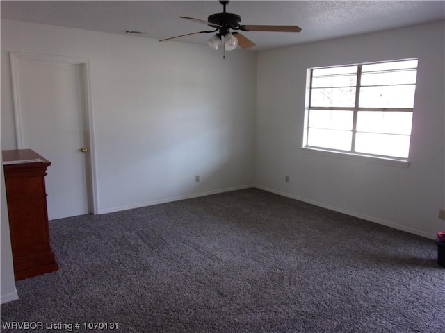 carpeted empty room with ceiling fan