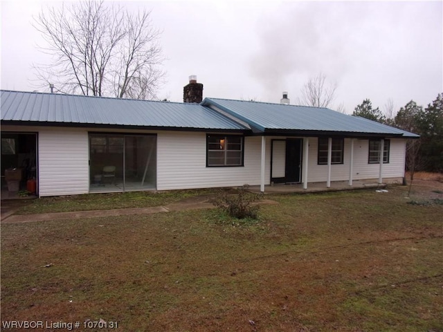 back of house with a yard