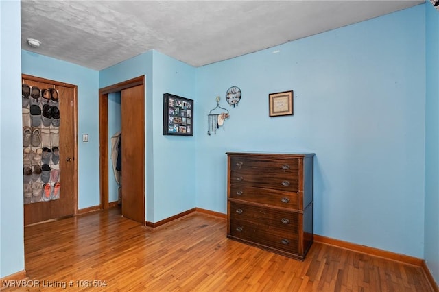 1310 Pigeon Creek Rd, Mountainburg, AR 72946 - bedroom featuring light wood finished floors and a closet
