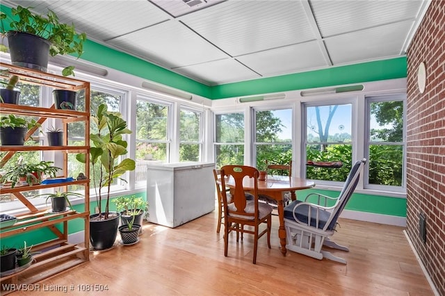 1310 Pigeon Creek Rd, Mountainburg, AR 72946 - sunroom / solarium featuring wood finished floors and brick wall