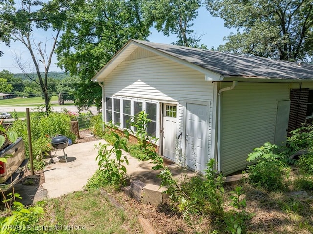 1310 Pigeon Creek Rd, Mountainburg, AR 72946 - view of property exterior featuring a shingled roof and an outdoor structure