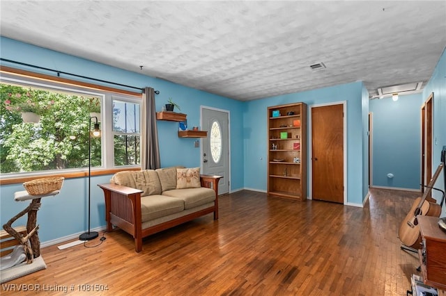 1310 Pigeon Creek Rd, Mountainburg, AR 72946 - living room featuring baseboards and wood finished floors