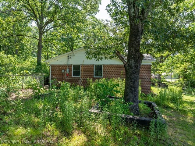 1310 Pigeon Creek Rd, Mountainburg, AR 72946 - view of side of home with brick siding