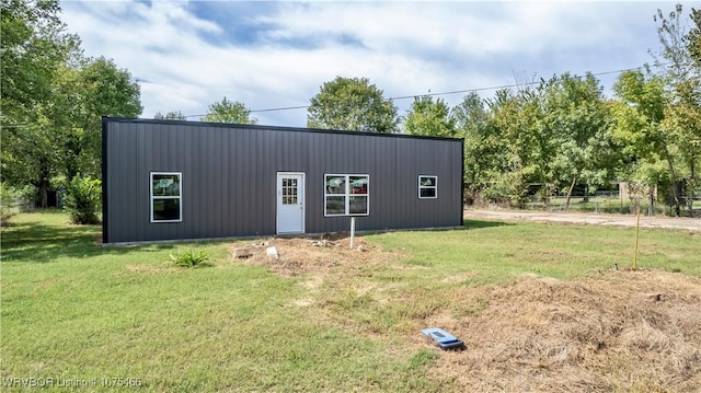 view of outbuilding with a lawn