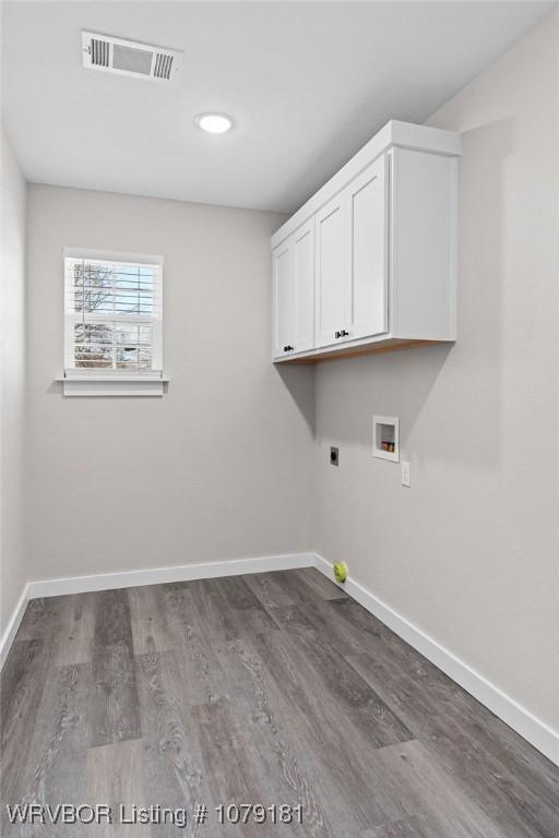 laundry area featuring hookup for a washing machine, visible vents, electric dryer hookup, and baseboards