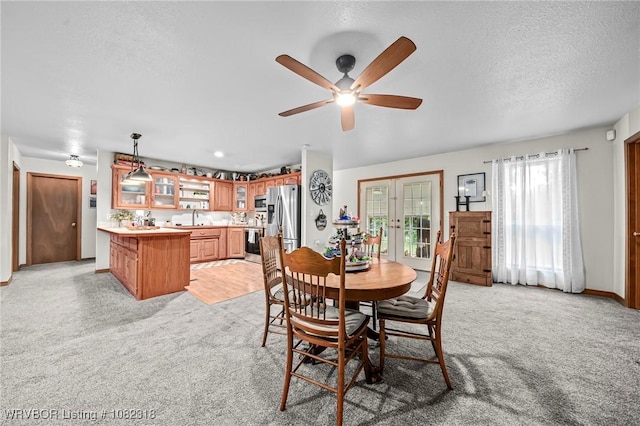 106078 S 4715th Rd, Muldrow, OK 74948 - dining space featuring light carpet, a ceiling fan, and a textured ceiling